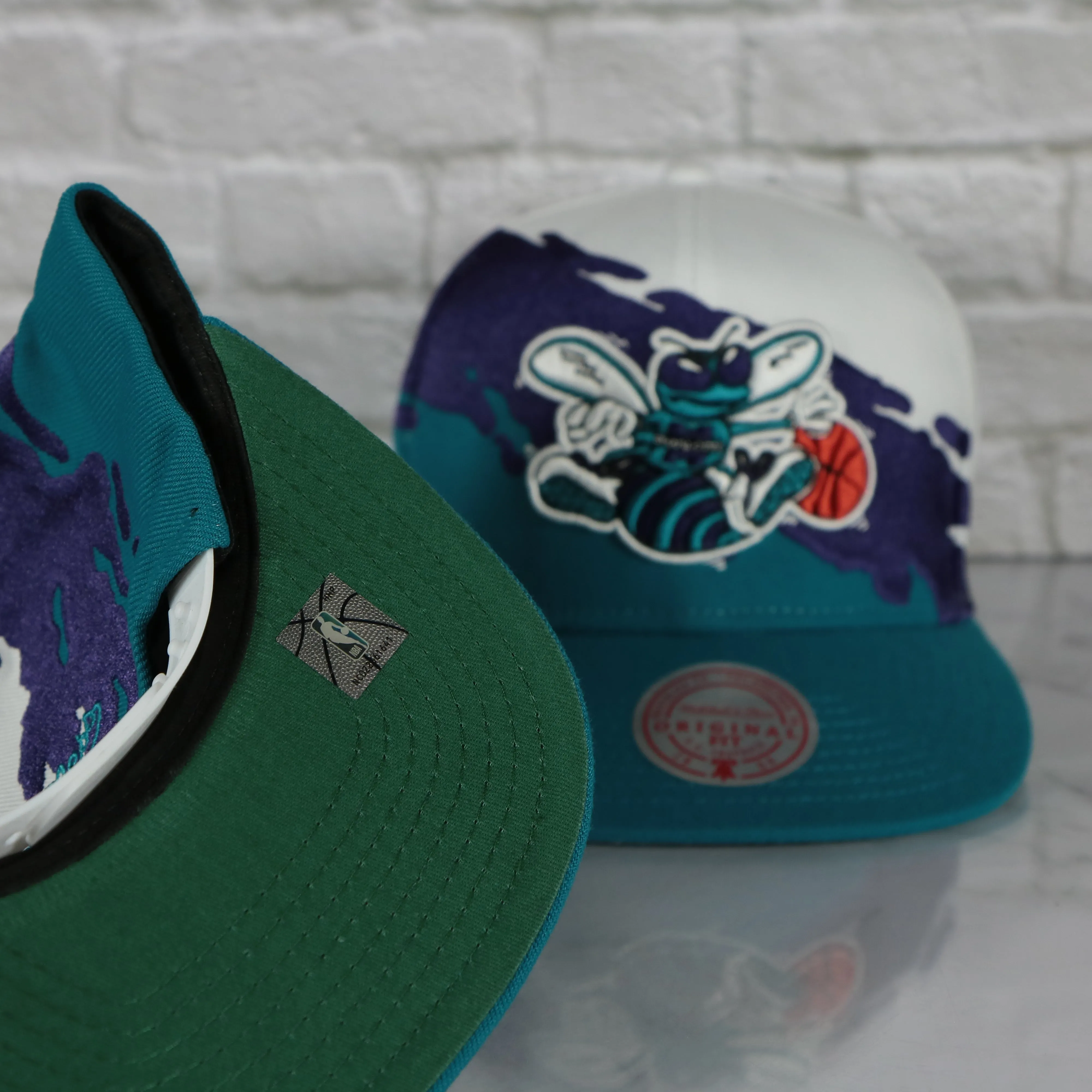 Charlotte Hornets Vintage Retro NBA Paintbrush Mitchell and Ness Snapback Hat | Purple/White/Teal