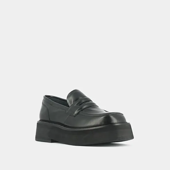 Platform loafers in black glazed leather